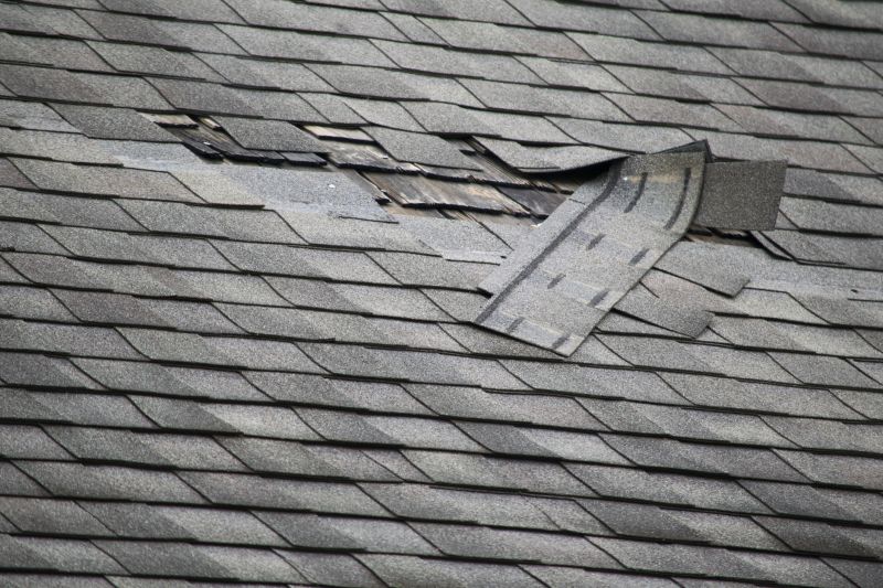 Damaged Shingles Being Replaced